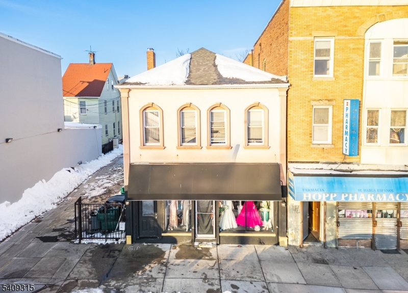 Your next income-producing opportunity is here. This mixed-use property offers nearly 2,000 square feet of ground-level commercial space, plus a well-laid-out two-bedroom apartment above both with separate utilities for maximum efficiency and flexibility. Positioned in an area experiencing active development and strong momentum, this is the kind of asset investors look for: versatile, cash-flow capable, and well-located. Opportunities like this don't come around often!
