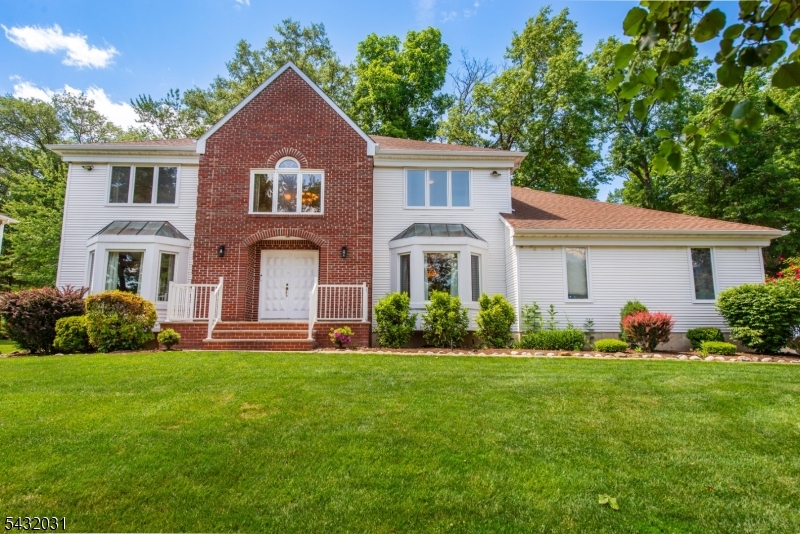 Stunning colonial nestled in one of East Hanover's most sought-after neighborhoods.Exceptional curb appeal, expansive living spaces, and an impressive open floor plan, this 4 bedroom, 3.5 bath home is designed for both luxurious everyday living. Step through grand double doors into a dramatic two-story foyer. Hardwood floors, soaring ceilings and generously sized rooms create an elegant yet inviting atmosphere throughout. The beautifully updated eat-in kitchen is the heart of the home, featuring abundant cabinetry, granite countertops, a large center island and sliders leading to the outdoor entertaining area. Host unforgettable gatherings in the formal dining room or relax in the spectacular family room with high ceilings, a classic mantle, and cozy wood-burning fireplace. A spacious living room, private den ideal for a home office, laundry room, and powder room complete the main level. Retreat upstairs to the primary suite featuring vaulted ceilings, walk-in closets, and a bath with double sinks, jetted tub, skylights and stall shower.Three additional bedrooms and main bath complete the second floor.The finished basement offers endless possibilities with a recreation room and full bath with oversized shower, perfect for a media room, gym or playroom. Step outside to your private backyard oasis with a beautiful patio, ideal for outdoor dining and entertaining.This exceptional home offers a perfect blend of elegance, comfort and lifestyle in a premier location.