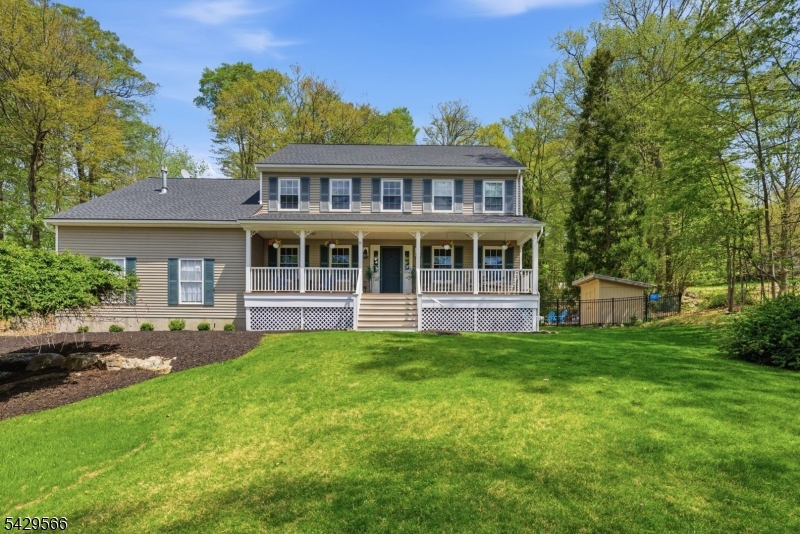 Impeccably maintained Colonial with deeded boat slip and private putting green in Jefferson Twp, offering the ideal blend of lake living and everyday comfort on a super private no traffic street. This 4 bedroom, 2.5 bath home features a spacious layout with hardwood flooring, custom molding, and modern finishes throughout. The kitchen includes a large center island, stainless appliances, tiled flooring, pantry, and eat in dining area surrounded by oversized windows overlooking the backyard and outdoor entertaining spaces. Bright living and dining rooms provide excellent natural light and seamless flow for gatherings year round. The second level features a spacious primary suite with full bath, soaking tub, stall shower, and walk in closet. Outside, enjoy an in ground pool, open front porch, landscaped grounds, storage shed, private putting green, and multiple areas designed for relaxing and entertaining after a day on the water. Deeded boat slip access adds a true lake lifestyle experience with convenient boating, fishing, and waterfront enjoyment nearby. Additional highlights include a full partially finished basement with game room and workshop space, oversized 2 car attached garage, and blacktop driveway with ample parking.