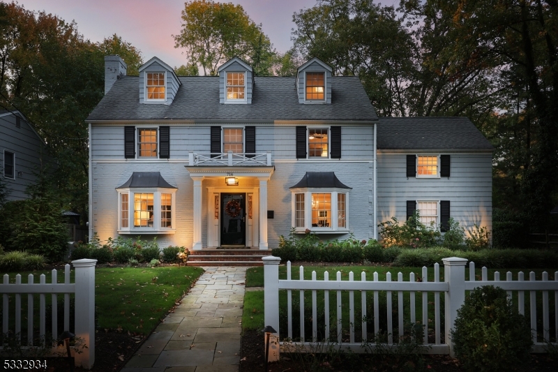This meticulously maintained 5-bedroom, 3.1-bath Colonial is a true gem in a charming neighborhood. The property features welcoming curb appeal with a white picket fence border, setting the stage for the elegance & comfort found inside. Upon entry, you'll be greeted by a formal living room w/fireplace, bay window, built-in storage & French door to the family rm. Opposite, the FDR also boasts a bay window. The renovated kitchen (2018) is a chef's dream, showcasing Quartz countertops, breakfast bar, SS appliances, command center and separate eating area w/built-in banquet style seating, skylight & step-down access to the backyard. Open to the kitchen, the renovated family room (2022) features a vaulted ceiling, gas fireplace, palladium window, & double French doors to the deck. The 1st floor also includes a renovated powder rm (2021). On the second floor, the primary suite offers a private, renovated bath (2022) w/dual-sink vanity, free-standing tub & stall shower. 3 addl spacious bedrooms and a renovated full hall bath (2021) complete this level, along with a convenient laundry area. The 3rd floor adds more living space with a bedroom, sitting room & full bath. The lower level is home to a rec room & ample storage. Outdoors, the beautifully landscaped grounds feature a three-tier deck & attached 2-car garage. This home is ideally located near schools, downtown Westfield NYC & trans, making it a fantastic opportunity for anyone seeking a move-in-ready home in a desirable area.