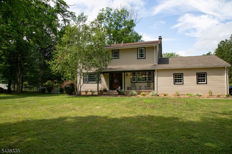 Welcome to this spacious and beautifully maintained 4-bedroom, 3 full-bath home located in highly sought-after Chester Township, known for its top-rated schools, natural beauty, and charming community atmosphere. The heart of the home is the updated kitchen featuring custom cabinetry, granite countertops, stainless steel appliances, and an open layout ideal for everyday living and entertaining. Hardwood floors flow throughout much of the home, while the inviting family room offers heated floors and a cozy wood-burning fireplace. The generous primary suite and additional bedrooms provide comfortable living space for  guests. Natural light fills the home, creating a warm and welcoming feel throughout. Outside, enjoy a private, fully fenced backyard surrounded by mature trees and landscaping. The expansive lawn and deck provide the perfect setting for outdoor entertaining, recreation, gardening, or simply relaxing in a peaceful setting. Highlights include: 4 Bedrooms, 3 Full Bathrooms - Updated kitchen with granite countertops and stainless steel appliances - Hardwood flooring - family room with heated floors and wood-burning fireplace - Large deck overlooking a private fenced yard - mature trees and expansive outdoor space - Located in desirable Chester Township with top-rated schools - Move-in ready ideally located, this home offers the perfect combination of comfort, updates, and outdoor living. NEW SEPTIC INSTALLED IN 2025