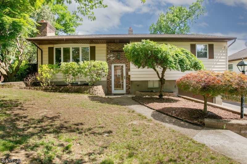 Walk to Lake from this bilevel with an addition of a family room and full bath! Deck off family room.  Bring your touches to this property, great location. Eat in kitchen with separate dining room. Primary room can be put back to two rooms.