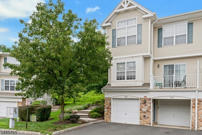 Welcome to this beautifully maintained end-unit townhome in the highly desirable Mountainview community of Green Brook. Offering 2 bedrooms, 2.5 bathrooms, a finished basement, and an attached oversized one-car garage, this move-in-ready home combines stylish updates with functional living space. The bright, open floor plan features gleaming hardwood floors and spacious living and dining areas. The kitchen offers granite countertops, updated stainless steel appliances, a pantry, and plenty of workspace. Step outside to a private deck overlooking open space - the perfect spot to enjoy your morning coffee or unwind at the end of the day. Upstairs, you'll find two generously sized bedrooms, each with its own full bathroom, including a spacious primary suite with a cathedral ceiling, a California closet, and a beautifully renovated bath featuring imported Italian tile, double vanities, and a steam shower. A convenient second-floor laundry room adds to the home's thoughtful layout. The finished basement provides flexible space for a home office, gym, media room, or playroom, with direct access to the attached oversized one-car garage. Residents enjoy low-maintenance living with community amenities including a pool, tennis courts, playground, guest parking, landscaping, and snow removal. Conveniently located near Routes 22, 287, and 78, NJ Transit, shopping, dining, and highly rated schools, this home offers the perfect combination of comfort, convenience, and location.