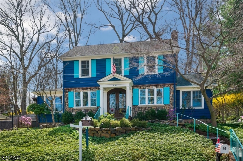Elegant Charm, Unbeatable Location!Classic Center Hall Colonial set mid-block on a tree-lined street in the heart of Morristown close to everything you need. This spacious home offers 3 generous bedrooms, 2 renovated full baths, gleaming hardwood floors, large windows, high ceilings, and designer finishes throughout.  The main floor begins with a welcoming foyer flanked by an oversized living room with fireplace and a cozy family room with walls of custom built-ins. There's plenty of room to host everyone for dinner in the formal dining room featuring unique custom flooring and second fireplace, plus open flow into an updated kitchen with wood cabinets and updated stainless steel appliances. A separate space off the living room can be an office/den, and a full bath with shower and custom tile wet bar completes this level. The second floor houses all 3 bedrooms, including a sunny primary, serviced by a full hall bath with dual vanity, bathtub, and separate shower. On the 3rd level a huge walk-up attic offers vast possibilities to add additional living space. Laundry, utilities, and a workshop are in the basement. This property also boasts delightful curb appeal that extends to a shady and private backyard with patio for warm-weather entertaining, as well as a detached 2-car garage and a gardening shed. You'll enjoy the proximity to Morristown's shopping and dining options and being blocks away from recreational activities and pool at Burnham Park.