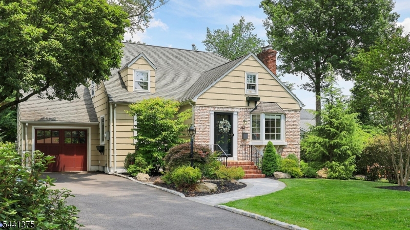 Stunning Westfield Colonial offering the perfect blend of timeless charm, modern comfort, and an unbeatable location! From the moment you step into the sun-drenched living room, you'll be captivated by the gleaming hardwood floors, elegant wood-burning fireplace, oversized windows and open inviting floor plan. The formal dining room is ideal for hosting dinners and celebrations, while the spectacular chef's kitchen is sure to impress with granite countertops, custom wood cabinetry, stainless steel appliances, a center island, and a spacious dining area highlighted by a dramatic floor-to-ceiling window overlooking the lush, private backyard. The first floor also features a lst floor bedroom, den perfect for guests, a home office, or flexible living needs and full bath. Upstairs, you'll find 3 generously sized bedrooms and 2 full baths, including a luxurious primary suite with a soaring vaulted ceiling, abundant closet space and a spa-inspired bath complete with a jetted soaking tub and separate shower. Step outside to enjoy the beautifully landscaped, private yard an ideal setting for relaxing, entertaining, and enjoying the outdoors. All this in one of Westfield's most desirable neighborhoods, just moments from top-rated schools, vibrant downtown Westfield, parks, dining, shopping, and the NYC train. This is the home you've been waiting for!