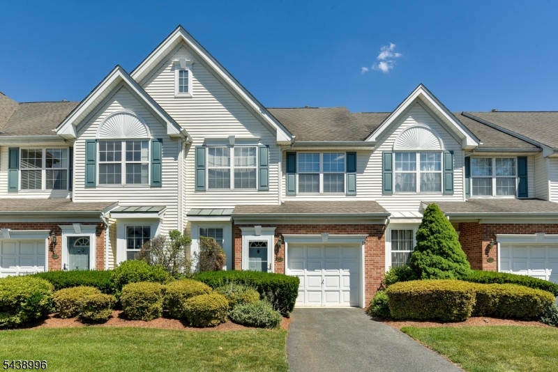 Experience easy sophisticated living in the sought-after community of Cambridge Heights.  This beautifully updated Buckingham model features hardwood floors throughout, an inviting living room on the first floor with direct access to the garage, a custom updated kitchen adjacent to the cozy dining room with a gas fireplace and powder room on this level. The spacious second floor features a primary suite with a full bathroom and walk-in custom closet designed by California Closets.  There is also a second bedroom, second bath and an additional spacious multi-purpose room. Custom touches throughout include custom blinds, California Closets in bedrooms and laundry room.  Don't miss this opportunity to live in a resort style amenity community.  It includes a sparkling outdoor pool, tennis courts, clubhouse, and exercise room all within the security of a gated community. It's ideally located for commuting. Walk to the bus, walk or take the jitney to the train, and easily accessible to major highways.