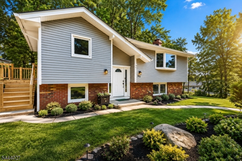 Welcome to this beautifully renovated bi-level home, where modern updates meet breathtaking lake views. offering 4 bedrooms and 2 full bathrooms, this move-in-ready home is designed for both everyday comfort and effortless entertaining. Step inside to a bright, sun-filled living room featuring wide-plank flooring, recessed lighting, and a stunning bay window that showcases picturesque lake views while filling the space with natural light. The heart of the home is the updated kitchen, complete with stainless steel appliances, a breakfast bar, and an open flow into the dining area, creating the perfect setting gatherings. Downstairs, the spacious family room is anchored by a charming wood-burning fireplace, providing a warm and inviting space to unwind. Step outside onto the deck, ideal for morning coffee, summer barbecues, or simply relaxing while taking in the peaceful surroundings. Additional features include a built-in one-car garage, parking for up to four vehicles, and a thoughtfully designed layout that offers flexibility for today's lifestyle. combining tasteful renovations, and generous living space, this home presents a rare opportunity to enjoy the perfect balance of comfort, convenience, and year-round lake living.