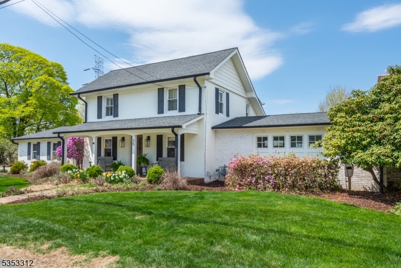 This stunning custom Colonial home offers timeless elegance and modern comfort on nearly 1 acre of flat, fenced and professionally landscaped land. Starting with the main home, there are 4 spacious bedrooms & 1.1 beautifully renovated baths. This home has been completely updated throughout with the highest quality finishes. The stunning sun filled kitchen is sure to please your "Inner Chef" complete with "Yorktowne" cabinetry, quartz countertops, professional grade exhaust hood & gas range. Additionally, this home features a formal dining room, spacious living room with cathedral ceilings, classic custom wood beams and a heat producing "Mendota" gas fireplace. As you proceed outdoors, you will see tons of beautiful specimen plantings, gardens, a fully fenced yard with a 6' privacy fence & another gorgeous structure complete with a finished room, gorgeous full bath, a Fujitsu ductless system providing  AC and Heat as well as an oversized 4 car garage!  So many possibilities! This home offers, public water, natural gas, central air and a new 4 BR Septic completed in 2024. Patio with "Sunsetter" shade system. RV hook up. Generator Plug installed. Yard complete with automated LED Exterior lighting and so much more.