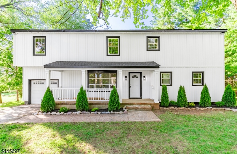 Rare find! Welcome to 1379 Blair Court, a reimagined modern farmhouse estate tucked away at the end of a highly coveted Bridgewater cul-de-sac. Boasting 5 bedrooms and 3.5 baths across 3,397 sq ft of thoughtfully redesigned living space, this exceptional residence blends timeless architecture with high-end, luxury finishes throughout. Situated on a beautifully landscaped 1.19-acre lot, the expansive, usable backyard offers endless possibilities for entertaining, recreation, or creating your own private outdoor retreat. Stunning curb appeal is showcased by crisp white board-and-batten siding, contrasting black trim, a welcoming covered front porch, and an attached garage. Inside, discover a sun-drenched, open-concept floor plan with soaring ceilings, multi-level living spaces, pristine flooring, and a striking fireplace feature wall. The seamless layout flows effortlessly into the gourmet chef's kitchen, complete with a massive waterfall island, premium quartz countertops, custom white shaker cabinetry, and top-tier stainless steel appliances. The luxurious primary suite features an oversized bedroom, double vanity, and a custom tile walk-in shower, while the expansive finished lower level offers the perfect recreation room, media space, gym, or guest retreat. Every inch of this home shows exceptional craftsmanship and designer finishes, creating a truly turnkey opportunity in one of Bridgewater's most desirable locations.