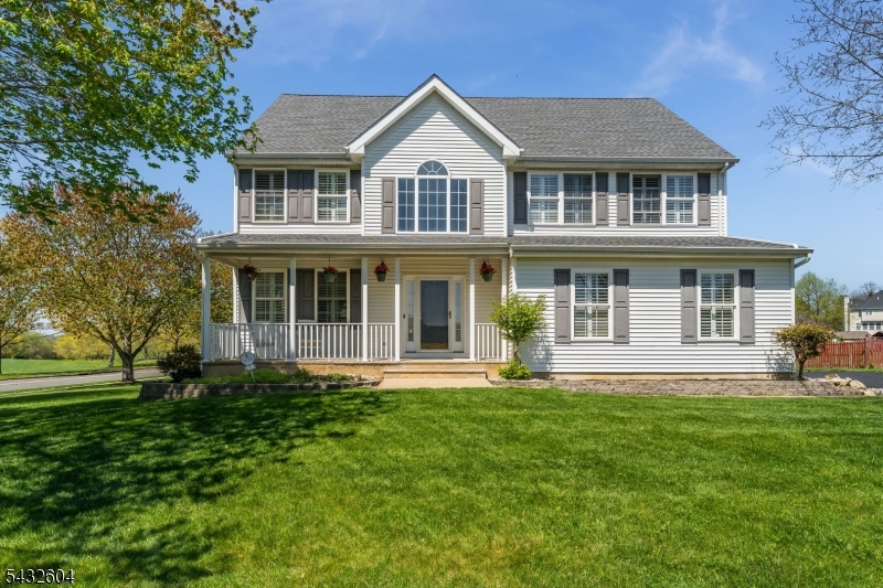 Shows like a model home! The ultimate flex in Wyndham Farms, this updated Colonial commands one of the neighborhood's best lot, directly across from open space with a massive, level backyard made for hosting. Packing 4 BR, 2.5 baths, a finished basement, and a 2-car side garage, this turn-key powerhouse boasts over $80K in high-end upgrades. The main level serves pure aesthetic: freshly painted interior, formal DR & LR with new hardwood floors, new plantation shutters throughout, and a dramatic 2-story FR with a sleek gas fireplace. The spacious EIK features updated LG s/s appliances and sliders to a massive rear deck with a built-in PDC Seasons Spa hot tub your new favorite wind-down spot. Upstairs, the primary suite is the ultimate sanctuary: tray ceiling, custom walk-in closet, and a brand-new, luxury bath (2024). This space features an oversized seamless glass shower, standalone soaking tub, double vanity. 3 more bedrooms and a full bath complete the level. The finished basement is pure bonus space, ready for a home gym, gaming lounge, or content studio. Zero gatekeeping here all the expensive mechanicals are already locked down: new roof/gutters (2021), gutter guards (2023), new HVAC & air purification (2021), and brand new water heater (2026).  Plus redone Driveway (2020) and new shed (2019). Approx. 3000 square feet of living space with the finished basement. Low-cost natural gas and public utilities. Minutes to Rt 78, shopping, parks, & golf.  Just move right in.