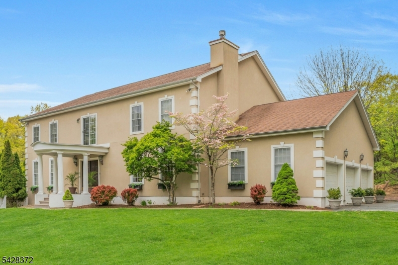 Tucked on a quiet cul-de-sac in Upper Montclair, this custom-built home complete with a private In-law suite, offers rare space, privacy, and flexibility - minutes from the NYC direct train, top-rated Montclair Schools, Upper Montclair shopping center and Montclair's vibrant downtown.  The main level features a living room with fireplace, formal dining, family room, and gourmet kitchen with dedicated prep kitchen. A sun-drenched sunroom overlooks the heated in-ground pool, deck, and patio.  Upstairs, four bedrooms each have en suite baths. A sitting area at the top of the stairs makes a perfect home office or retreat.  The ground level sets this home apart: two bedrooms, full kitchen, living room, dining area, full bath, and its own entrance - offering exceptional flexibility for guests who value their own routine, or a live-in caregiver.  A 3-car attached garage, driveway parking for six, and proximity to parks, hiking trails, tennis courts, and the Presby Iris gardens complete this truly rare Montclair offering.