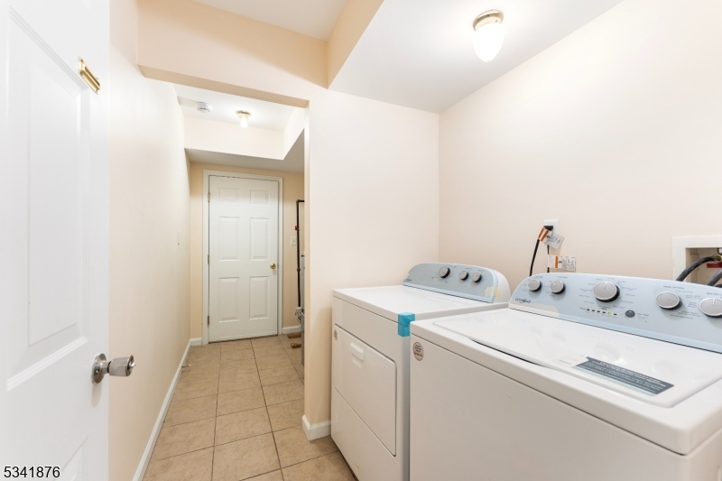 Welcome to this modern two-family home, perfectly designed for both investment opportunities and comfortable living. This property, built in 2009, features a ground floor that boasts a spacious family room, a versatile office, and a full bath, all with convenient access to a private, fenced-in yard ideal for entertaining or relaxation. The upper levels encompass two well-appointed units, each offering three generously sized bedrooms and two full baths. The master suite is a true retreat, complete with a walk-in closet and a luxurious en-suite bath, providing a perfect sanctuary for relaxation. Second floor has laundry in unit while first floor unit has it downstairs. Additional highlights include freshly painted interiors, refinished hardwood floors throughout, and ample parking with space for four cars on the wide concrete driveway. This home is conveniently located near major highways, ensuring easy access to NYC and surrounding areas. Property will be delivered vacant, excellent opportunity for maximum rent income. This beauty is a must-see, whether you're looking for a great investment opportunity or a place to call your own. Don't miss out on this gem schedule your showing today!