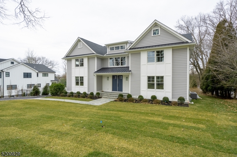 This amazing 6-bedroom 6.1-bathroom top to bottom renovation by local builder J Michael's Properties will take your breath away from the moment you step inside. On a 1/2-acre lot in the heart of the sought after Rolling Hill Section of Chatham this home has approx.7,200sqft laid out across 4 floors. Enter into a grand 2 story foyer and tons of natural light from the Anderson 400 series windows. The 4" hardwood floors throughout and 9ft ceilings on the first floor give this home a grand feel. Custom detailed moldings/casings, recessed LED lighting, and in ceiling speakers for entertaining and attention to detail are just a few of the features that make this home special. The custom gourmet kitchen w/ flush inset handmade cabinetry made in the USA by Great Northern, massive 10' center island, SS Wolf 48inch double oven/range, 42" subzero fridge/freezer & Marvel wine fridge, all with custom quartz countertops, Primary bedroom, bathroom, and WIC will have 11' tray ceilings, quartz/marble vanities, and a massive WIC w/ a library ladder! Spacious, bright bedrooms, a full finished walk-out basement with Rec room, mud room, and space for a home gym/office, and a walkup 3rd floor attic. designer lighting package, Kohler fixtures, prewired for AV/alarm. new utilities and 3 zone HVAC, 30-year HD timberline roof, Hardi Board siding, Azak trim, trex deck and a bluestone walkway and front porch are just a few of the amazing high-end features that complement the quality of this renovation.