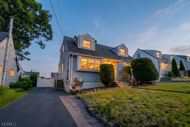 This beautiful 4-bedroom 3-full-bath Cape Cod checks all the boxes. The heart of this home is the stunning updated kitchen. Enjoy your morning coffee at the kitchen table or take it outside to the oversized deck overlooking the yard. The living room is bathed in natural light thanks to the large windows, giving the space an airy feel. The main level offers two comfortable bedrooms and a full bathroom. Upstairs, you will find the primary suite and an additional bedroom. Need more room? The finished basement delivers! Whether you are setting up a home gym, hosting a movie night, entertaining around the bar, or doing laundry... there's a place for everything here. The above ground pool is included, but could use a new liner. As a bonus, the home sits across from 16th Ave Elementary School. You can't beat that convenience! Close to shopping, dining, and major commuter routes, this home has it all. Transit to NYC and Hoboken is very close. Make your appointment today for a private showing.