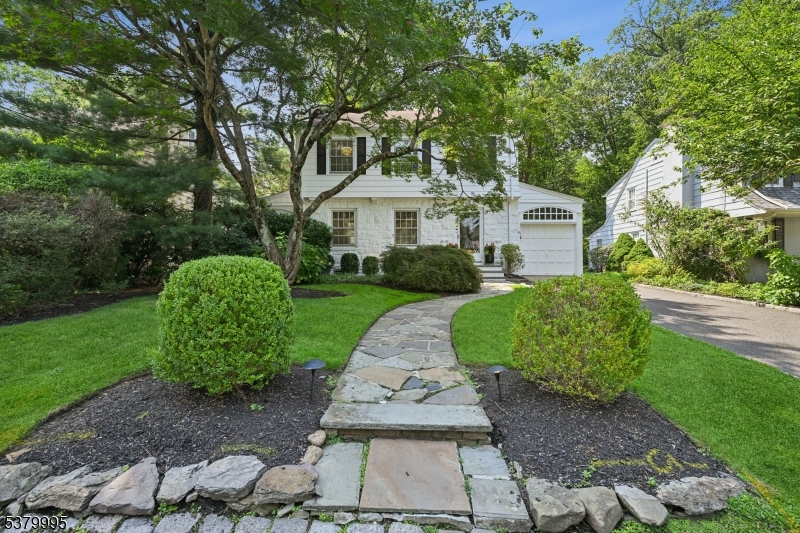 For Comp purposes only - Discover the perfect balance of charm and modern living in this beautiful Glenwood gem. Located just half a mile from direct train to New York City. With timeless character and thoughtful 2018 updates, this residence offers both comfort and convenience for today's lifestyle. The first level welcomes you to an inviting foyer that gives way to a beautifully updated kitchen. Here, you'll find a cozy breakfast nook and easy access to a sun-filled office, creating the perfect blend of gathering and private spaces. The formal dining room invites guests to linger while the office / sunroom allows for productive work from home days. Completing the first level is the updated powder room, mud room and garage access to make busy lives easier. Upstairs, three bedrooms await, including a spacious primary suite complete with abundant clothing storage, and an en-suite bath w/ radiant heated floors. The third level adds even more flexibility, featuring a fourth bedroom and bonus loft area. The fully finished basement extends the living space further, offering a versatile recreation area. It also features a finished laundry room, complete with a double sink and workspace. Step outside and enjoy the level, private, backyard a rare find that provides endless possibilities for outdoor entertaining, gardening, or simply relaxing on your oversized patio.  ACCESSIBLE LOCATION TO MIDTOWN DIRECT TRAINS, SCHOOLS, PARKS, AND VIBRANT DOWNTOWN
