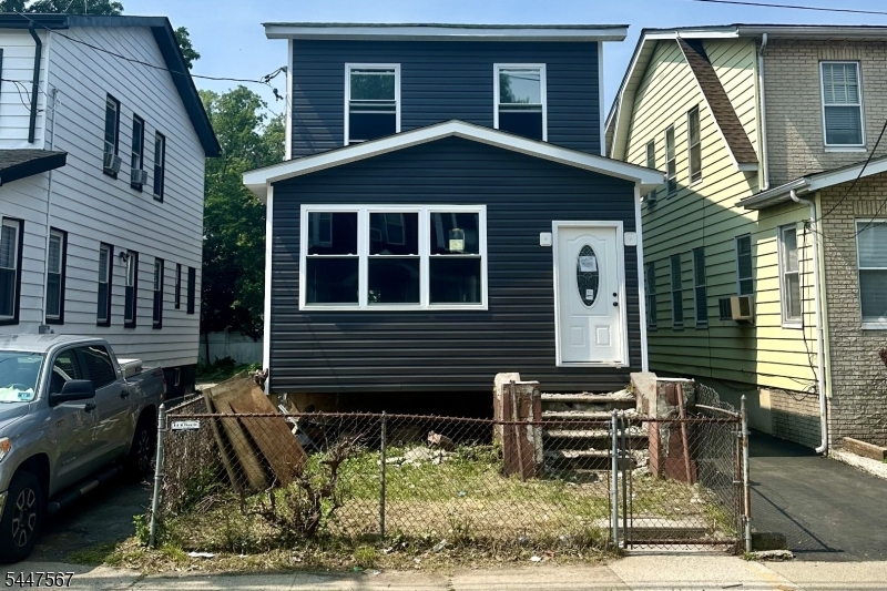 Welcome to 90 Paine Ave, Irvington - a completely rebuilt and expanded single-family home offering the comfort and peace of mind of new construction. Fully permitted from top to bottom, this transformation includes new framing, a rear addition, updated mechanical systems, modern finishes, and significant structural improvements throughout all three levels. Additional upgrades include a new roof, siding, windows, HVAC, electrical system, and more.Offering 5 spacious bedrooms, 2.5 baths, and 2,141 square feet of finished living space, this home provides exceptional versatility with a spacious and flexible floor plan designed to accommodate a variety of lifestyle needs while maintaining a single-family layout.The first floor features an open-concept kitchen with center island, dining area, living room, two generously sized bedrooms with walk-in closets, and a full bath. The second floor offers three oversized bedrooms with walk-in closets, a second full bath, laundry area, and a flexible floor plan to suit a variety of living arrangements.The finished cellar features approximately 7-foot ceilings, HVAC, a half bath, and a separate side entrance-ideal for recreation, a home office, fitness space, or additional living area.Situated on a residential street with a shared driveway and parking for two vehicles, 90 Paine Ave combines modern construction, generous living space, and exceptional functionality. Seller is a licensed New Jersey real estate professional.