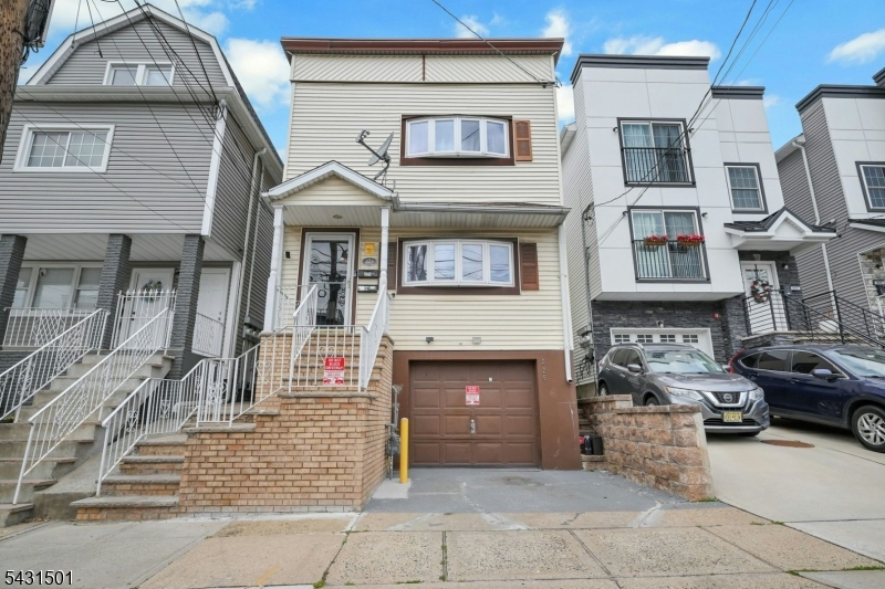 Prime 2-Units Multi Family home.   4-bedrooms, 3-bathrooms, in the vibrant Peterstown neighborhood of Elizabeth. Perfectly positioned near  New Jersey Turnpike  Route 95, The beautiful greenfield of Mattano Park, Frank J Ciccarelli Highschool,  Christopher Columbus Elementary School. It is also near a football and soccer field for public enjoyment. It presents a prime opportunity for homeowners or savvy investors!!. Enjoy the added convenience of  Solar Panels, a 1-car garage plus a driveway for effortless parking. Unit 1 welcomes you through a bright sunroom entrance with a closet space; also features large windows for natural light bringing the outdoors in. It has 2 bedrooms, 1 full bathroom, and an open-concept kitchen crafted for comfort and  daily entertaining. Unit 2 also has a sunroom ideal for serene personal leisure; also with closet space for extra storage. Complete with 2 bedrooms, 1 full bathroom, and a spacious eat-in kitchen for casual gatherings. Both units provide separate entrances and utilities for enhanced privacy and independence. The fully finished basement elevates living options with a recreational room, additional full bathroom, summer kitchen, and laundry area. Unwind in the generous backyard, designed for carefree outdoor enjoyment. Property is offered in "As-is" condition.  Make this your next home! Schedule a viewing today!
