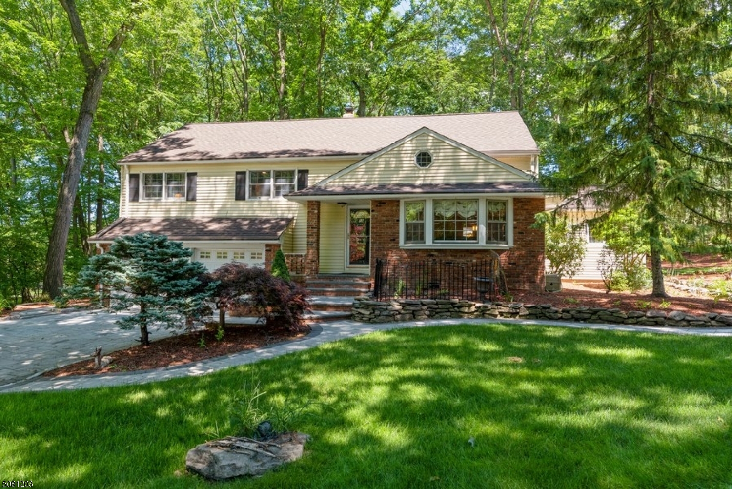 Enjoy plenty of space & peaceful privacy in this beautiful Split Level home w/ 4 BR and 3 FB nestled on an oversized landscaped lot. This custom home boasts gleaming hardwood floors, light & bright rooms, & a fluid layout designed for comfortable living & effortless entertaining both inside & out. The welcoming foyer opens to a warm & inviting LR w/ a bay window & a banquet-sized DR w/ chair rail & crown molding. The kitchen features granite counters, stylish custom cabinetry, SS new appliances, & a breakfast bar. Off the DR, French doors open to a beautiful two-level deck ready to enjoy warm weather BBQ. The second & third levels encompass a master w/ an en suite bathroom, 3 additional BRs, & a fully updated bathroom in the hall. The ground level includes two large rms & walkout to the backyard. Must see!