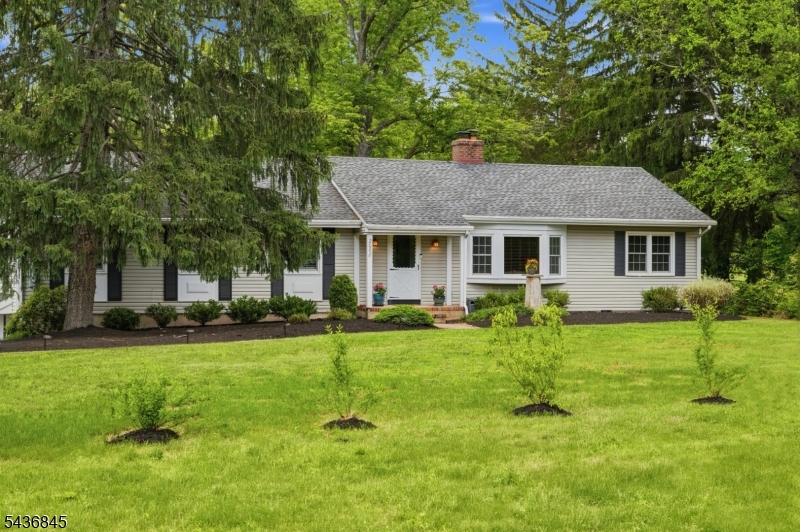 Welcome home to this beautifully maintained 4 bed, 2 bath ranch nestled on an acre of professionally landscaped grounds. It is updated, move-in ready, and waiting for its next chapter. Hardwood floors carry throughout, tying each space together with a warm, polished feel. Natural light pours in across the main living areas, where a wood-burning fireplace anchors the family room. The kitchen is the heart of the home with solid wood cabinetry, equally functional as it is beautiful, with a sweet eat-in area perfect for quiet mornings. The kitchen extends seamlessly into a living room complete with additional cabinetry and countertop space, making everyday living as easy as it is inviting. From the kitchen, the flow continues into the formal dining room, which opens straight onto the sun porch and beyond. Out back, a private patio and tranquil koi pond sit surrounded by mature, professional landscaping. The primary suite features a generous walk-in closet converted from a fourth bedroom which is easily restored if desired. A finished basement adds meaningful square footage for whatever life calls for, and the attached 2-car garage rounds out the picture. Minutes from the D&R Canal towpath, Six Mile Run, Princeton, public transportation, shopping, dining, and more; this one truly has it all. Recent Updates: Sewer Line (2023) Interior Painted (2023) HW Floors Refinished (2023) Well Tank (2024) AC Unit (2024) Outdoor Front Stairs (2024) Primary Bath Refresh (2025)