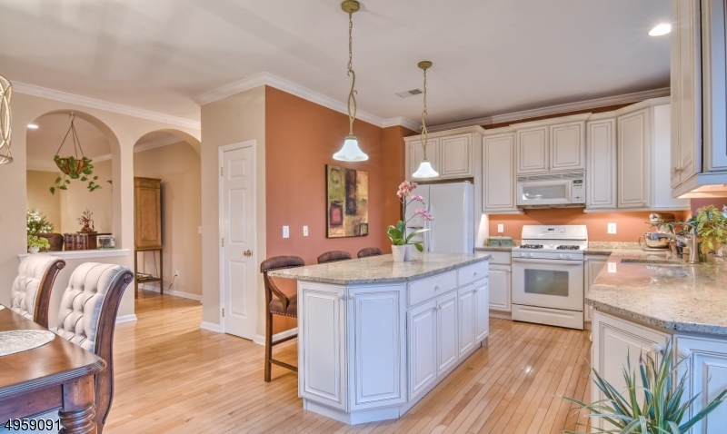 Bright and airy, lovely three-story townhome just steps from Lake Hopatcong with its own private deeded dock. Wonderful lake views abound in this bright floor plan. The oversized living room has a wonderful double-sided gas fireplace which it shares with the full-sized dining area off the upgraded kitchen. Upstairs is the laundry area with 3 ample sized bedrooms.  The basement has its own private patio and full bath.  The townhome complex is close to major commuting and shopping.  The clubhouse, gym and pool are just a part of the numerous amenities.  This is not just a home, its stay-cationing at its finest!