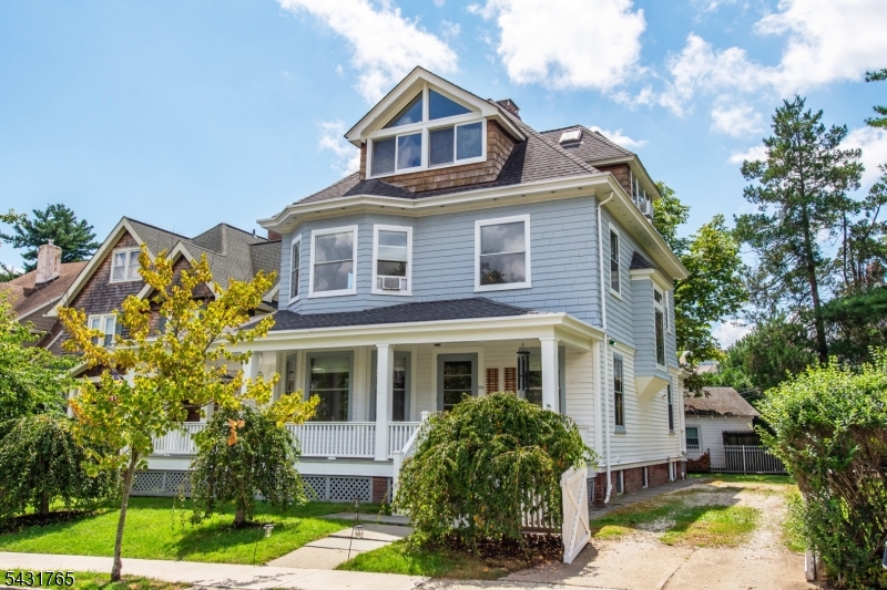 Welcome to this charming side hall colonial in the heart of Downtown Montclair's highly sought-after Walnut Street neighborhood. Perfectly situated just steps from restaurants, coffee shops, boutiques, theaters, parks, and direct NYC transportation, this home offers the ideal blend of suburban charm and city convenience. This sun-filled single-family home features 4 bedrooms, 3.5 bathrooms, and three spacious levels of living space, including a private third-floor primary suite with stunning NYC views. Rich hardwood floors, abundant natural light, and timeless architectural details create warmth and character throughout. Enjoy morning coffee or evening gatherings on the inviting wrap-around porch, while the fully-fenced backyard provides a private outdoor retreat with room for pets, play, and entertaining. The finished basement rec room adds valuable bonus space. With unbeatable walkability, classic charm, and one of Montclair's most vibrant locations, this is a rare opportunity to truly have it all!
