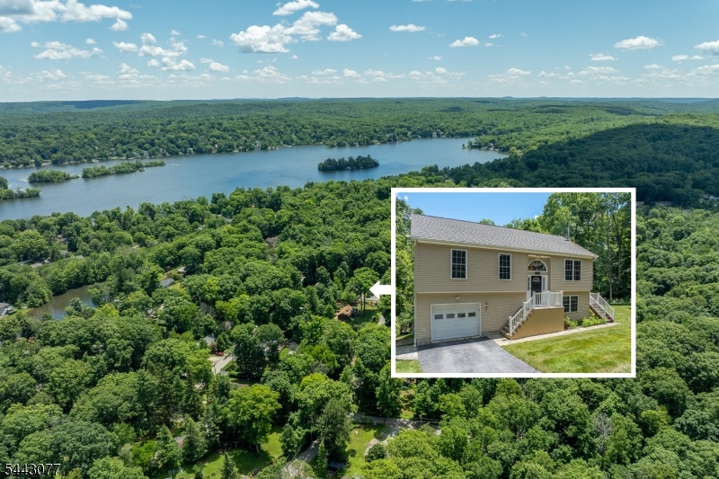Set in the heart of Highland Lakes, this updated 3-bedroom, 2- full bath home offers comfortable living with a warm and practical layout. The kitchen is designed for everyday ease, featuring stainless steel appliances, space for casual dining, and convenient flow into the adjoining living and dining areas. From the dining room, sliding glass doors open to a rear deck overlooking the yard, creating a natural extension of the home for summer meals, gatherings, or quiet time outdoors. The primary suite provides a bright and private retreat with its own full bathroom, while two additional bedrooms offer flexible space for guests or a home office. Downstairs, the finished lower level adds valuable flexible living space centered around a wood-burning stove, making it a comfortable spot to unwind during the colder months. NEW Central Air! Portable generator included! As part of Highland Lakes Country Club, owners enjoy access to a private lake community known for its relaxed outdoor lifestyle. Amenities include five lakes, seven beaches, swimming, boating, fishing, tennis, pickleball, playgrounds, a clubhouse, and a full calendar of seasonal events and activities. With recreation, community, and natural beauty all close at hand, this home is well suited for year-round living or a peaceful lake-area escape.