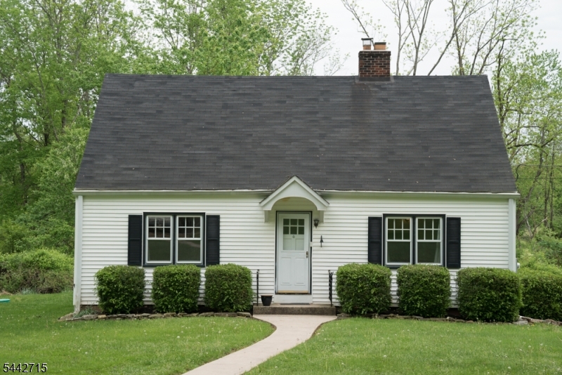This well-maintained, move-in ready Cape Cod home features six spacious rooms with three bedrooms, one full bathroom, powder room and a functional layout and is nestled on a large lot along a quiet country road. The interior boasts a mix of classic hardwood flooring and comfortable carpeting throughout. Cozy up in the living room by the wood-burning stove, or enjoy meals in the bright eat-in kitchen which includes a refrigerator. A highlight of the property is the beautiful three-season sunroom, offering a peaceful view of the expansive yard. Have full use of the unfinished basement which includes a washer and dryer. No need to worry about lawn maintenance which is included - Tenant is responsible for snow removal. With three bedrooms, one full bathroom, powder room and a functional layout, this home offers serene country living in pristine condition.