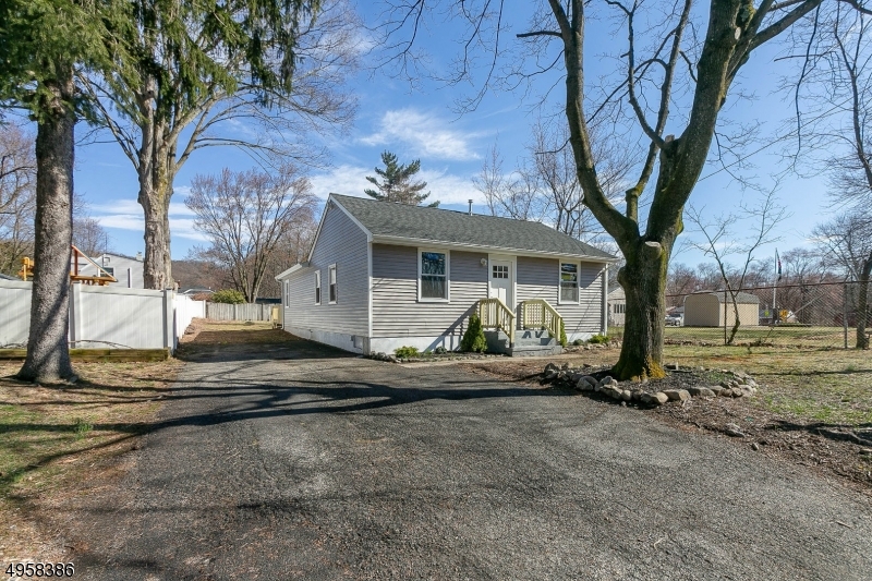 OPEN LAYOUT UNBELIEVABLE TOTALLY RENOVATED INSIDE AND OUT RANCH NEAR THE HEART OF DENVILLE!  BEAUTIFUL KITCHEN W/ GRANITE COUNTER TOPS, STAINLESS STEEL APPLICANCE, BRAND NEW HEATING/COOLING SYSTEM, MODERN NEW BATHS WITH ALL NEW FIXTURES. NEW FLOORING THROUGHOUT. NEW ROOF AND WINDOWS! THIS BEAUTY OFFERS ALL THE CONVENIENCES OF ONE FLOOR LIVING, LEVEL YARD, EASY ACCESS TO DENVILLE AMENITITES, COMMUTING, LOCAL SHOPPING, HOSPITALS, SCHOOLS AND SOO MUCH MORE! DONT MISS THIS TURN KEY OPPORTUNITY TO ENJOY THIS MODERNIZED RANCH! DECIEVING FROM THE EXTERIOR! SLIDER FROM KITCHEN PROVIDES ACCESS TO NEW DECK AND FENCED IN YARD.