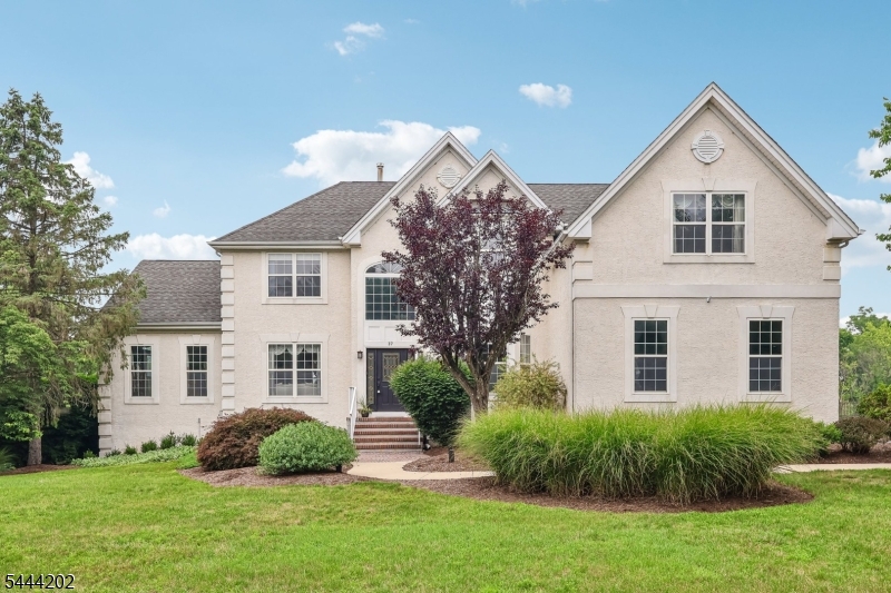 Prestigious Estates of West Amwell. Approx 5078 sq.ft. of living space w/finished basement. Timeless elegance, extensive upgrades & a layout perfectly suited for both everyday & living grand-scale entertaining. 4 bdrms, 4.5 bths.Home is highlighted by a beautifully remodeled gourmet kitchen that serves as the heart of the home. Expansive windows thoughout fill every room w/abundant natural light while capturing picturesque views of the surrounding landscape. Welcoming home office positioned near the entrance providing a private & professional workspace. Elegant formal living & dining rooms, a stunning conservatory surrounding by windows, decorative moldings, tray ceilings & soaring vaulted ceilings create an atmosphere of sophistication throughout. Luxurious upper level is anchored by an impressive primary suite featuring a private sitting room w/french doors, 2 oversized closets and an additional walk-in closet, creating a true owner's retreat. Generously sized bedrooms share a Jack & Jill bath, while a separate guest suite offers its own full bath and walk-in closet. Finished lower level offers additional living & entertaining space, while the exterior is equally impressive. Step outside to expansive upper & lower entertaining areas overlooking lush , professionally landscaped grounds and an oversized fenced-in-built-in pool, creating a private backyard retreat that backs to serene wooded surroundings & 3-car garage.Easy access to Manhattan, major interstates & NJ Transit.