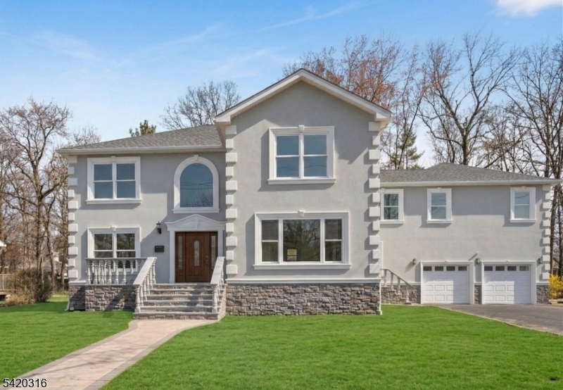 READY TO MOVE IN! Introducing this 5-bedroom, 4.5-bath Colonial offering 4,460 square feet of thoughtfully designed living space in the highly sought-after Lake Parsippany neighborhood. The exterior features sophisticated stucco accented by elegant stonework and marble detailing, creating timeless curb appeal. Inside, a grand double-height foyer welcomes you into an expansive open floor plan enhanced by high ceilings, recessed lighting, crown molding, and Andersen windows throughout. The gourmet kitchen is a chef's dream, featuring a large center island, stainless steel appliances, a pantry, and a formal dining area that flows into a spacious great room with a cozy fireplace. The functional first floor also includes a bedroom with an en-suite bath, a dedicated prayer/office room, a powder room, and a mudroom. Upstairs, the luxurious primary suite boasts multiple closets, a balcony, and a spa-inspired bath with a large walk-in shower. The second level is completed by three additional bedrooms, a second en-suite, a versatile office or second prayer room, and a convenient laundry room. Additional highlights include a two-car garage, unfinished attic storage, and hardwood flooring. The outdoor space is equally impressive, featuring a new Belgium block driveway for six cars and a backyard with both lawn and concrete patio space, and a shed. Dont wait to check it out.