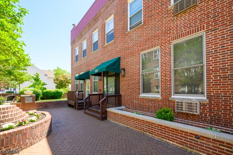 Welcome to this beautifully remodeled, move-in-ready second-floor condominium in highly desirable Westfield. This bright and inviting corner unit is filled with natural light and features soaring 10-foot ceilings, recessed lighting, and elegant crown molding that create an open, upscale atmosphere throughout. The thoughtfully updated one-bedroom, one-bath layout offers modern comfort and style, highlighted by refinished hardwood flooring and a cozy wood-burning fireplace that adds warmth and character to the living space. Surprisingly abundant storage, including multiple closets and built-in cabinetry throughout, provides exceptional space for everyday living and organization. A two-year-old washer and dryer conveniently located within the unit provide everyday ease and functionality. Enjoy the benefits of assigned parking in a secure underground garage, along with access to a picturesque courtyard and beautifully maintained common areas. 2 blocks to train, 3 blocks to downtown Westfield.  Pets allowed. No fee, just register pets.  HOA covers Water, Garbage, Heated secured garage, Recycling, Lawn maintenance, Snow removal. ELECTRIC bill about $150 a month.