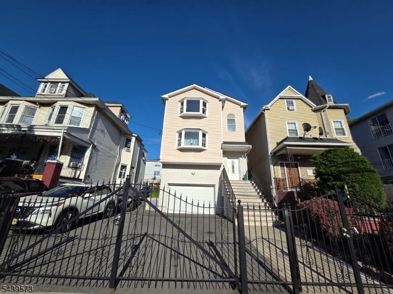 Beautiful owner-occupied two-family home in North Newark, just minutes from the desirable Forest Hill section. Built in 1998 and lovingly maintained by its original owner since 1999, this turnkey property offers exceptional space, versatility, and pride of ownership throughout. Each apartment features 3 bedrooms, an open-concept living room, dining area, and kitchen, plus separate utilities, central air, and its own laundry area. The first-floor unit includes a primary bedroom with a private full bath and an additional full bathroom. The second-floor unit offers a full bathroom and a spacious layout. The finished walkout ground level provides additional living space and includes a full bathroom. Freshly painted and well maintained. Original hardwood floors add warmth and character throughout the home. Exterior highlights include a newer roof (approximately 3 years old), newer stainless steel appliances in the first-floor unit (approximately 2 years old), new front bay windows on the first and second floors, and newly paved concrete exterior areas. Enjoy summer gatherings with the above-ground pool.  Ample parking accommodates 7-8 vehicles, plus an attached ground-level garage. Two additional detached garages at the rear of the property provide excellent storage space.  Conveniently located near schools, parks, restaurants, shopping, hospitals, public transportation, and major highways. A rare opportunity to own a move-in-ready, meticulously maintained multi-family home.