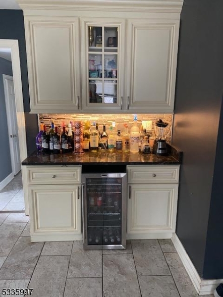 . Beautiful recently renovated home, home features large master suite which has walk in closet, Tub and walk in Shower, has rain head, wall sprayers and handheld wand, Princess suite has walk in closet, tub, walk in shower with rain head, wall sprayers and handheld wand along with heated floor. Two additional bedrooms are large and have walk in closets. Large Kitchen has center Island, butler pantry, and plenty of cabinets. The living room and Family room each feature wood fireplaces. The Formal Dining room has picture window. Main Bathroom features a freestanding tub and a walk-in shower. The finished basement features a rec/TV area, an Office, a library, utility room and half bath and has central air and heat. Two zone Heating and cooling is provided by two energy efficient units. The patio is perfect for cookouts and get togethers. Driveway is being resurfaced New Garage door is ordered Owner is a licensed NJ Realtor.