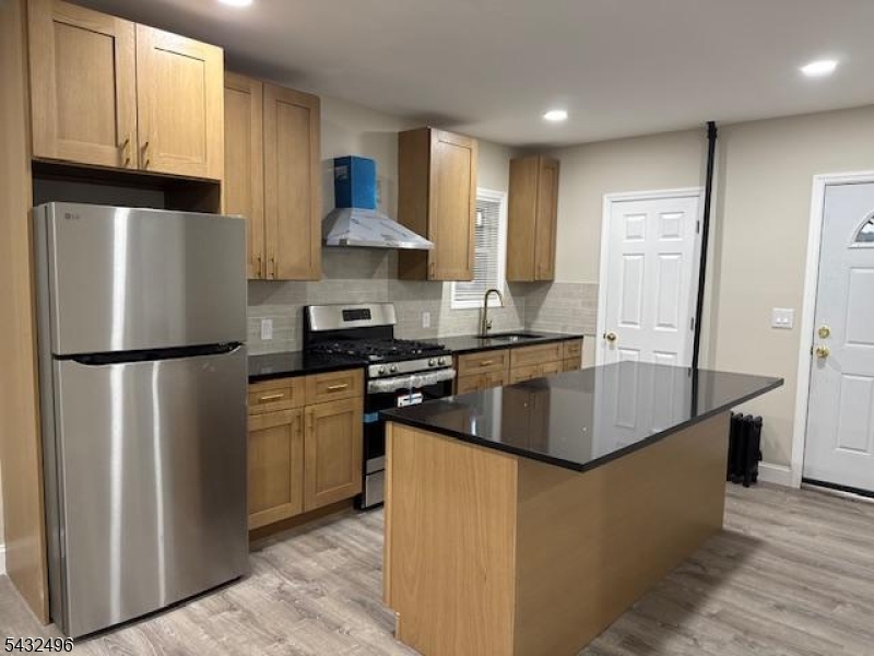 Completely renovated 4 bedroom first floor unit  includes the full finished basement with 2 rooms and laundry.