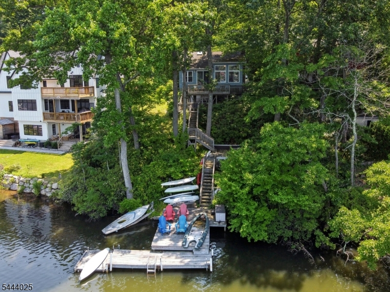 Wake up to the beauty of Highland Lakes in this move-in ready 2-bedroom, 1-bath waterfront home. Whether you're looking for a weekend escape, vacation home, or year-round residence, this property offers the perfect combination of comfort, recreation, and peaceful lakefront living.Inside, you'll find a warm and inviting living space with a gas fireplace, efficient mini-split air conditioning, and beautiful water views. Step outside to the spacious deck overlooking the lake, then head to your private dock for kayaking, fishing, swimming, paddleboarding, or simply relaxing along the shoreline.Located just minutes from Route 23, this home offers convenient access to everyday essentials while feeling a world away. Enjoy shopping, dining, wineries, and seasonal events in nearby Warwick, NY, spend the winter skiing and snowboarding at Mountain Creek Resort, or explore the hiking trails, lakes, and scenic beauty of Wawayanda State Park. Whether you're seeking a peaceful retreat or an active four-season lifestyle, this Highland Lakes waterfront home is ready to enjoy.