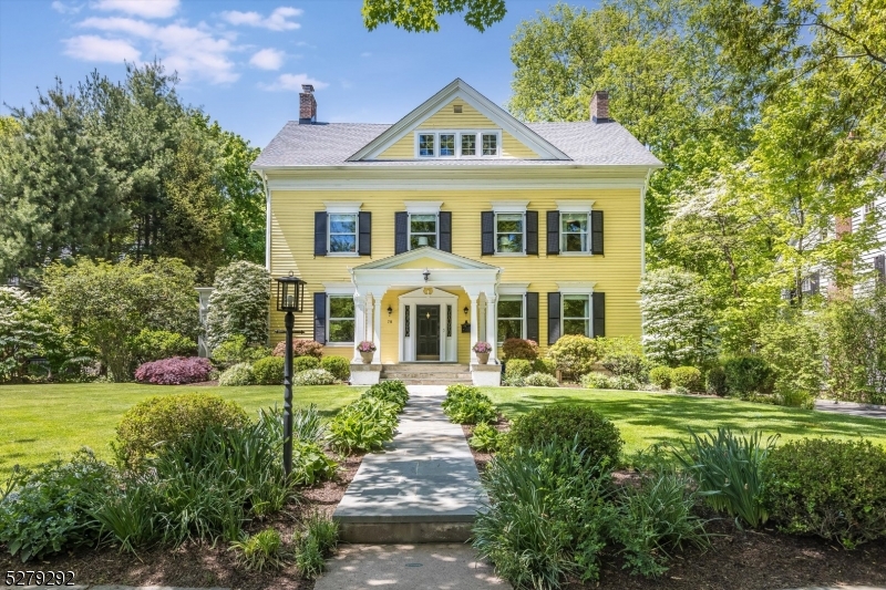 Curb appeal goals!! This classic Colonial is impressive from beginning to end. Step onto the inviting porch and through the grand foyer and you'll know your search is complete.To the left of the center hall foyer, a spacious living rm with WBF beckons, flowing effortlessly into a screened-in porch nestled under a canopy of mature trees. On the right, the formal DR and updated kitchen showcase a modern aesthetic with white cabinetry, s/s appliances, and striking soapstone countertops. The kitchen extends around the back staircase, offering a casual dining area with a heated flr and a convenient built-in desk. Ascend the curving staircase to the light-filled second flr, where the fabulous primary suite awaits with a beautifully renovated bath and private den/dressing room. Three additional bdrms, a full ba, laundry ctr complete this level. Continue to the third floor, where French doors reveal an artist's studio (perfect for a hangout /yoga room), two more bdrms, a full bath, and a bonus storage rm that could be repurposed as an office or bdrm. The full bsmnt provides ample storage, a finished rec room with pool table and bar, and a full ba w/jetted tub, perfect post-workout. Beautiful original moldings, high ceilings, and hardwood floors grace the entire home, while multi-zone central air ensures year-round comfort. Best of the best location in this historic gas lamp-lit town, just a few blocks from train to NYC and in the A+ Glen Ridge school district. Welcome Home!