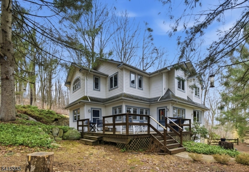 Located in Montville Township, this charming older home beautifully blends classic character with thoughtfully updated spaces, offering the best of both worlds timeless appeal and modern comfort. Set on over 1.6 acres of private property on a quiet dead-end street, the home provides exceptional privacy, natural surroundings, and the convenience of nearby shopping, dining, and easy access to major highways.The second floor was completely remodeled in 2000, creating a spacious layout designed for today's lifestyle. The highlight is the impressive primary bedroom retreat, featuring soaring vaulted ceilings that enhance the sense of space and natural light. The en-suite bath offers a spa-like feel with a separate shower, soaking tub, and double vanity. This level also includes a convenient laundry room and two additional bedrooms.The first floor retains the warmth and charm of an older home, with a welcoming living room, spacious dining room, updated kitchen with breakfast nook, den/library with wood-burning fireplace, powder room, and private office. These rooms provide comfortable, flexible living space while preserving the home's inviting character.Outdoor living is just as appealing, with an oversized deck ideal for entertaining or simply enjoying the peaceful setting. Additional updates include all-new thermopane windows and maintenance-free vinyl siding, adding efficiency and easy upkeep to this distinctive property.