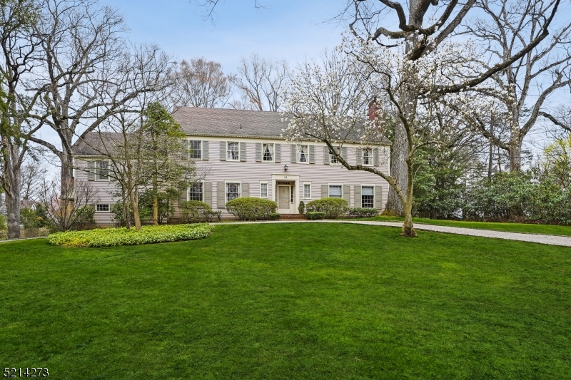 Classic Short Hills Colonial in an ideal LOCATION-- Glenwood School, short distance to train station, C.H. Arboretum and downtown shopping and restaurants! This charming and classic home is elegant and spacious with exceptional flow. Front foyer with hardwood floors, oversized Living Room leads to a large Sun Room overlooking the level and lovely backyard. Den / Office with hardwood floors, wood paneling and a gas fireplace. Formal Dining Room with china closet. Eat in Kitchen and Mud Room / Laundry Room with access to the two car garage. A grand front staircase plus a back staircase leads to the second level that includes a Primary suite with two walk in closets and large bath, plus four other bright and cheery Bedrooms, a Loft and two additional full Baths.  A walk up attic has unlimited potential and storage as does the full unfinished basement. The level .68 acre property with an in-ground sprinkler system has a pretty patio and is sunny and private. Do not miss this special Short Hills home with top-rated schools and easy access to NYC!