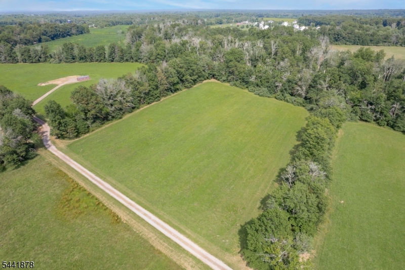 Build your dream home at 35 Barbertown Point Breeze Rd, a rare opportunity to create a custom residence in one of Hunterdon County's most picturesque settings. A building package is available, allowing you to bring your dream home to life without the compromises of purchasing an older home in today's competitive market. Nestled on 4 acres and bordered by mature trees on three sides, this exceptional homesite enjoys a remarkable sense of privacy. The property adjoins a preserved 26-acre farm and the tranquil Lockatong Creek, helping to protect the surrounding landscape and views for years to come. For those seeking an even larger estate setting, an additional contiguous 17.63 acres is available for purchase, creating a combined offering of 21.63 acres (see MLS#4036280). Imagine designing a home tailored to your lifestyle, with room for outdoor living, recreation, gardening, or simply enjoying the beauty of the countryside. Experience the serenity of rural living while remaining just minutes from everyday conveniences, shopping, dining and the charming river towns of Frenchtown, Stockton, Lambertville and New Hope. Ideally located with convenient access to Routes 202 and 78, the property offers an easy commute to both Philadelphia and NYC, making it the perfect retreat for full-time residents and weekend escape seekers alike. Don't miss this unique opportunity to own acreage that feels worlds away from it all,yet remains remarkably connected to everything you need.