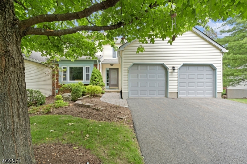 Enjoy carefree living in this 3 bedroom, 2.5 full bath spacious Granville Model end unit townhouse featuring plenty of natural sunlight throughout. The family room showcases hardwood floors, wood fireplace & sliding doors leading to the deck for entertaining. Eat in kitchen leads to formal dining room & living room. Main floor has direct access to laundry room & garage on the main floor. Generous size bedrooms await you on the 2nd floor with a master suite with full bath & walk in closet. As well as two additional bedrooms and a full hallway bathroom. A large finished walk out basement provides additional living space with sliders to the patio. Convenient location to schools, shopping & highways. Pet friendly neighborhood, community pool & playground!