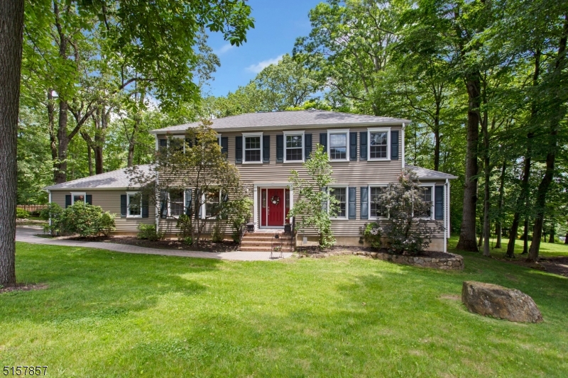 Stately Colonial on one of Randolph's nicest streets.  This lovingly cared for 4 bed 2 and 1/2 bath home has a large entry foyer with 2 coat closets.  The foyer opens to the formal living room with hardwood floors on the right and formal dining room on the left also with hard wood floors.  The dining room has wainscoting and and indented wall for your hutch. The large country eat in kitchen is just off the dining room.  Large double pantry and newer stainless appliances and sliders to the Trex Deck make this a kitchen everyone will want to spend time in.  A large laundry room leading to the garage makes for easy transfer of groceries from the car to kitchen. Relax in the family room off the kitchen with a wood burning fireplace.  This home has great flow and built for entertaining  Almost all the windows have been replaced with Andersen windows.   The upstairs has a nicely carpeted primary bedroom with en suite and 3 large bedrooms with hard wood floors and a main bath.  Both baths have been refreshed with new cabinets and sinks. A poured concrete foundation in the unfinished basement is waiting for you to add your touches. Gorgeous park like yard and very private wooded back yard to enjoy.  Randolph School System and close to rts 10, 46, and 80.  A must see if you are looking for class elegance and well cared for home in a sought after area.