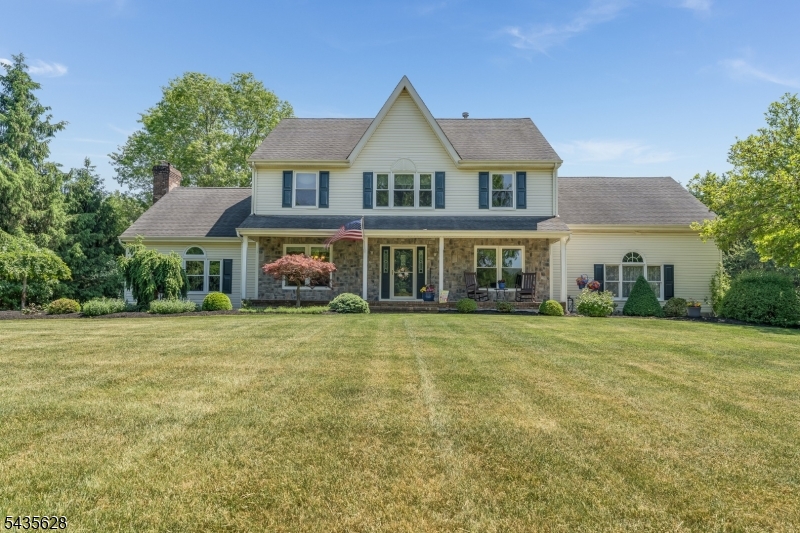 Welcome to this magnificent, classic true five-bedroom Colonial nestled in the desirable North Forty community of Raritan Township. Offering an exceptional blend of elegant architecture and resort-style living, this beautifully maintained home featuring a classic covered southern front porch, a grand two-story, step-down family room that serves as the dramatic heart of the home, alongside a private first-floor home office perfect for today's remote work needs. The home office can easily be modified to a bedroom utilizing the existing adjacent full bathroom. The spacious layout flows seamlessly into the updated kitchen with SS appliances and bright breakfast eat-in room, offering the perfect backdrop for daily living and entertaining. Upstairs, the second level uniquely accommodates five spacious bedrooms and two full bathrooms, providing expansive and versatile living quarters. The living space extends to a fully finished basement, offering endless possibilities for recreation, media, or gym space. Car enthusiasts and hobbyists will appreciate the pristine, finished 3-car garage. Step outside into your own private paradise. The open and spacious backyard features a premium, heated in-ground saltwater pool, completely framed by professional, high-end hardscaping and lush, meticulous landscaping. This turn-key home delivers an unparalleled luxury lifestyle inside and out. Additional features and amenities include Public Water, Public Sewer, and Natural Gas utilities.