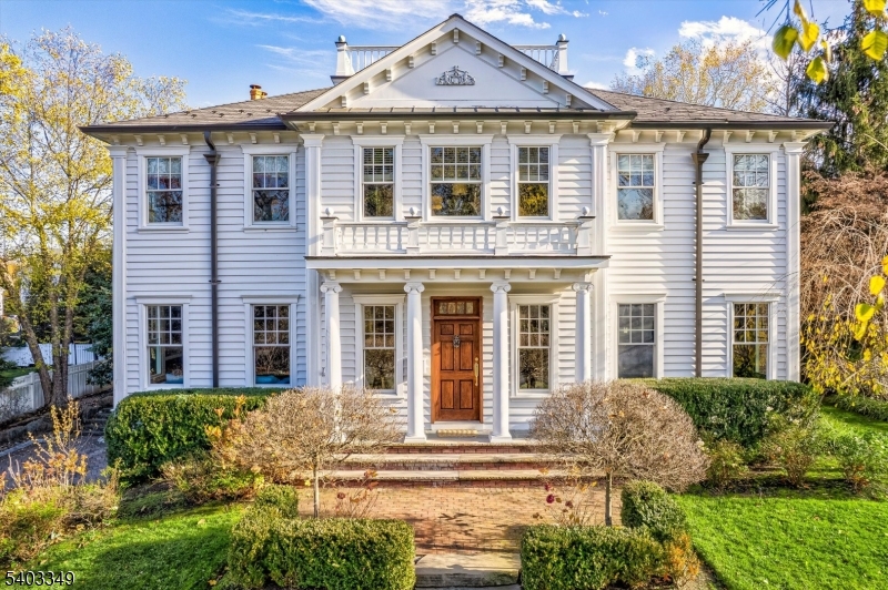Welcome to this impeccably designed home nestled in Madison's highly desirable Hill neighborhood. Exquisite millwork, high ceilings, and meticulous details throughout conveys a unique Southern charm, and an atmosphere of timeless sophistication.The seamless layout leads to the heart of the home: chef's kitchen with a generous center island, open to the family room, and a butler's pantry connecting to the banquet -sized dining room for effortless entertaining.The elegant living room showcases an impressive coffered ceiling, adding architectural depth and refined character to the space. Upstairs, six spacious bedrooms and three baths provide private living quarters. The luxurious primary suite is a true retreat, featuring a gas fireplace, a private balcony overlooking the backyard, and a custom ensuite marble bath with a steam shower, soaking tub, and dual sinks. A walk-in closet offers abundant space. Outdoors, a professionally landscaped backyard oasis awaits.  A paver patio anchors the space with an outdoor kitchen and a  wood-burning fireplace, while two covered tiered porches provide peaceful places to relax. Modern conveniences include a basement-to-kitchen dumbwaiter and a second floor laundry chute. This exceptional home offers an effortless blend of luxury and functionality in one of Madison's most sought -after neighborhoods.