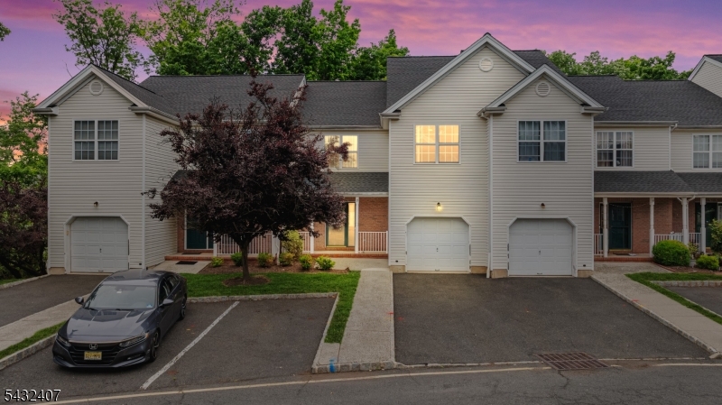 Location! Location! Location! a beautifully updated 2-Bd, 3.5-Ba townhome with a fully finished wlk-out bsmnt and 1-car garage. Lots of 2026 upgrades & open floor concept. Step inside you will find fresh neutral paint (2026) with luxury crown moldings & recessed Lights. The living/dining rooms flow into the family room w/ a wood-burning fireplace and mantle, opening to a private patio with wooded views. A powder room on the 1st flr. 2024 yr updated kitchen is a chef's dream with 42'' cabinets, granite countertops, tile backsplash, breakfast bar/center island, KitchenAid SS appliances, and garbage disposal (2023). Upstairs, you'll find the extended primary suite with two closets (a room size closet, and a spa-like en-suite bathroom) The En-suite baths feature a jacuzzi tub, stall shower and Dual vanity. A spacious second bedroom with a large closet plus a linen closet completes the 2nd level. Private 1-car garage with automatic opener. Plus, this home offers a Finished wlk-out basement that includes a full bathroom with a standing shower, open recreation room, utility room, laundry area, and high ceilings. The possibilities are endless! Additional upgrades include BRAND NEW washer (2026), updated roof (2026), basement walls (2023), hardwood flooring & carpet (2023), water heater (2018), HVAC (2018) for peace of mind. Convenient access to major highways including rt 18, 22, 27, 28, I-287. Just minutes from the Major Nj Train Stations, Shopping, Restaurants, Library & More.