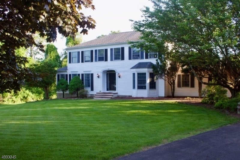 This gracious colonial w/resort-like backyard is sure to check off all your "MUST HAVES"! Spacious & light-filled chef's kit w/center island, wall oven and warming drawer, oodles of cabinets, granite counters, 5 burner stove w/pot-filler; counter seating and casual dining area w/vaulted ceiling and gas fireplace. Over-sized Living/Family rm w/wood burning FP; formal dining rm with bay window; finished basement with ample storage. Sliders off kitchen lead to expansive  covered deck overlooking the gorgeous backyard with IG pool, gazebo, putting green & utility shed. Nicely landscaped with paver & stone walkways; flowering perennials, ornamental grasses & shrubs. Located on culdesac on south side of "the Valley" Top Rated Long Valley/West Morris Schools.  Public Water/Sewer. 2 fridges in kitch, newer stove &d/w