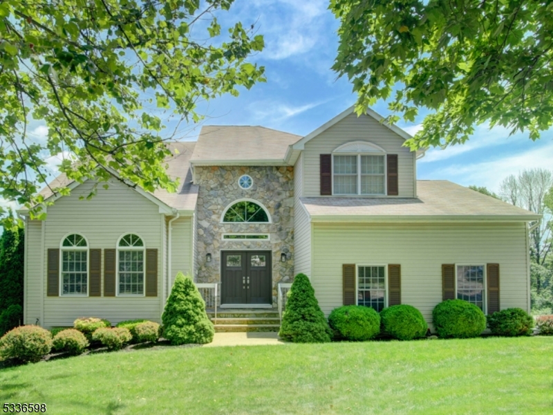 Welcome to this 4 bedroom, 3.5 bath, beautiful colonial perched on a lot in desirable Hunters Ridge with spectacular views. It is timeless, well maintained & move in ready. It boasts a spacious open floor plan, perfect for good flow, functionality & entertaining. Enjoy natural light beaming through the windows creating a bright & inviting space. The spacious kitchen boasts modern GE Profile appliances, ample counter space, plentiful cabinetry, pantry & separate dining area. Formal living & dining rooms conveniently connect kitchen. Comfortable family room with wood burning fireplace & newer sliders lead to the large deck providing space for outdoor dining & entertaining where you can soak up the scenery. Ascend to second floor to primary suite featuring large walk in closet and large bath w dual vanity, soaking tub & shower, 3 other bedrooms plus main bath. Enjoy easy access to your beautiful backyard/patio from the added bonus of the walkout basement, providing a seamless flow between indoor & outdoor living and increased value. Basement also has a full bath, dry bar & pool table is included. Special highlights include, central Vac, wired alarm system, water heater replaced 2022, generator hook up, 2 story foyer with replaced palladium windows & newer front doors, replaced sliding doors in fam room, wood floors throughout first floor, & public utilities.Fireplace being sold as is with no known issues.MULTIPLE OFFER REC'D - OFFER ACCEPTED