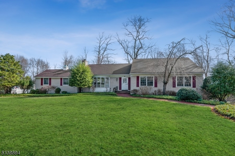 Spacious and elegant home in an ideal location! Ranch home with 4 bedrooms and 3 full bathrooms is nestled on an oversized lot on a tree-lined street in a sought-after neighborhood. It is convenient to both Convent and Morristown train stations, Routes 24 and 287 and close to parks, golf courses, a premier medical center and a lively downtown shopping and dining district. From the manicured front lawn and brick walkway, you are welcomed into the light-filled interior featuring hardwood floors, crown molding and trim details and fluid living spaces to accommodate comfortable everyday living and elegant entertaining. The large living room with a fireplace opens to a formal dining room with a chair rail and a bright eat-in kitchen clad with granite counters, stainless steel appliances and ample rich wood cabinets. A stunning office features a vaulted, wood-beamed ceiling and built-in cabinetry. The main floor continues with the primary bedroom suite including a walk-in closet and en suite bathroom, 3 additional bedrooms and a full hallway bathroom. More living space has been created in the lower level offering a light and bright family room with a second wood-burning fireplace, a full bathroom, a den, workshop, access to the attached two-car garage and plenty of storage. Off the family room, sliding glass doors lead to the lovely brick patio framed by mature plantings and shade trees.