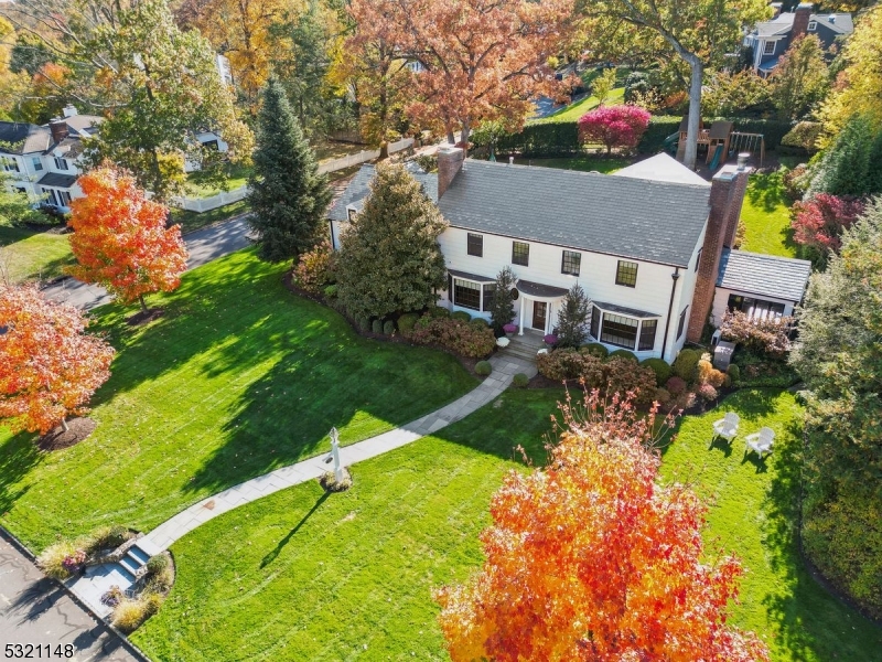 Discover this preeminent opportunity in Madison's most sought-after neighborhood, truly differentiated from other homes on-market. This stylishly restored colonial is THE choice for today's discerning buyer, accommodating everyday living & grand hosting by uniting classic architecture with modern amenities. Chic formal spaces & a well-appointed butler's pantry create a refined atmosphere for gathering, giving way to the heart of the home: an expansive kitchen & family room anchored on each end by an impressive center island and a crackling fireplace. Adjacent sun-filled den provides flexibility to work, host movie night or curl up with a book. Perfect for alfresco dining, sliding doors lead to a stone patio surrounded by thoughtfully curated plantings. Spacious primary suite plus 4 bedrooms with custom closets and 2 additional baths sit on the 2nd floor, plus a laundry room for utmost convenience. Lower level recreation expanse includes wet bar, playroom, & two-level gym, ensuring plenty of space to relax & play. The 2-story mud room with closets, 2nd laundry, & pet-bathing station is a unique feature, and the fully fenced backyard with elegant stonework, mature plantings and legacy trees is a true highlight. State-of-the-art network & Sonos AV systems included, plus comprehensive security system with exterior cameras & automatic driveway gate provides peace of mind. For those who value unparalleled craftsmanship, authenticity & the ideal neighborhood, your dream home awaits!