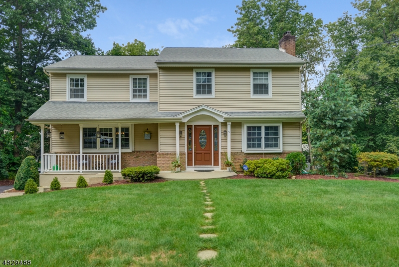 You'll fall in love with this easy-care brick-and-vinyl colonial. Tastefully remodeled for modern living, this immaculate home gives move-in-ready a whole new meaning with its upscale finishes, fine appliances, and flowing floor plan. The natural light bathes the spacious living room as the gas fireplace glows with warmth.golden hardwood floors travel underfoot into the dining room, all ready to host your next dinner party. The adjacent gourmet kitchen has everything you need to make cooking and serving meals a breeze.The bedrooms furnish restful sleeping space for all. The spacious master bedroom will pamper yourself in comfort. The deck overlooks the backyard as sliding doors lead to the kitchen. A patio, as well as a hot tub, makes your yard the place everyone will want to gather for parties.