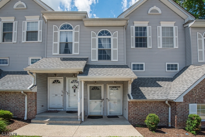 Don't miss your opportunity to own this beautifully maintained, freshly painted, move-in ready townhouse in the highly sought-after Victory Highlands community! This 2-bedroom, 1.5-bath home features an open-concept layout with hardwood floors throughout, a spacious living room with sliding glass doors leading to a private deck overlooking a peaceful wooded backdrop and scenic hillside views the perfect place to enjoy your morning coffee or unwind after a long day. The kitchen offers a breakfast bar with barstool seating, creating a great space for everyday living and entertaining. Upstairs, you'll find two bedrooms and a full bath, while the first-floor powder room adds everyday convenience.Enjoy the convenience of one assigned parking space, along with ample guest parking for visitors. Residents also enjoy a community playground, Dover School District bus pickup conveniently located at the community entrance, and an unbeatable location just minutes from Routes 46, 10, 15, I-80, and I-287. Shopping, restaurants, parks, and everyday conveniences are all just moments away, making this home the perfect blend of comfort, convenience, and low-maintenance living.